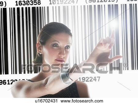 Young woman standing by barcode View Large Photo Image Stock Image - Young woman standing by barcode. Fotosearch
