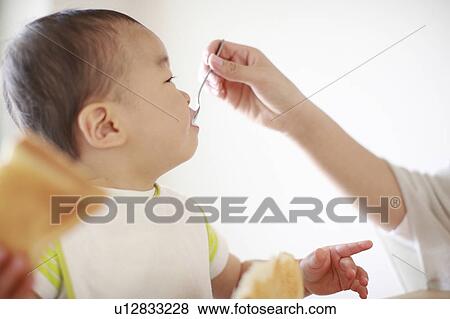 A boy eating breakfast View Large Photo Image Stock Photo - A boy eating breakfast. Fotosearch