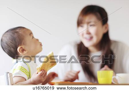 A boy eating breakfast View Large Photo Image Stock Photo - A boy eating breakfast. Fotosearch