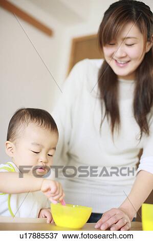 A boy eating yogurt View Large Photo Image Stock Photo - A boy eating yogurt. Fotosearch