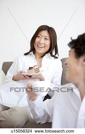 Picture - A couple having a teatime. Fotosearch