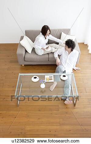 A couple having a teatime View Large Photo Image Stock Photo - A couple having a teatime. Fotosearch