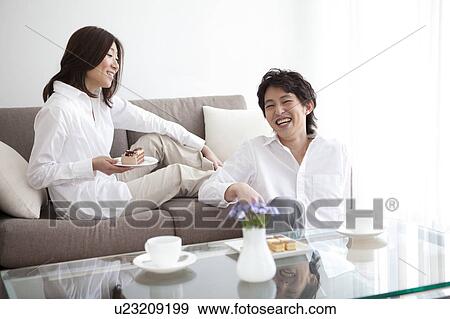 A couple having a teatime View Large Photo Image Stock Photo - A couple having a teatime. Fotosearch