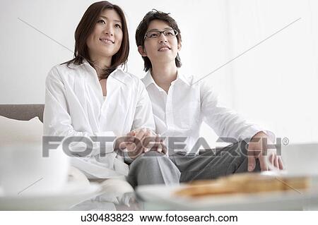 A couple holding hands View Large Photo Image Stock Image - A couple holding hands. Fotosearch