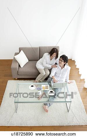 Stock Image - A couple using PC. Fotosearch