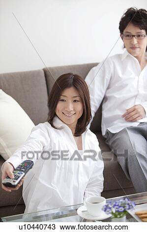 Stock Image - A couple watching TV. Fotosearch