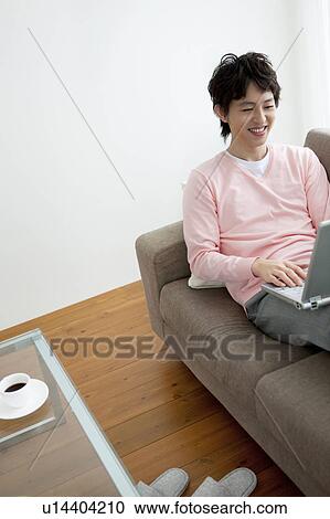 Stock Image - A man using PC. Fotosearch