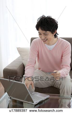 A man using PC View Large Photo Image Stock Photo - A man using PC. Fotosearch