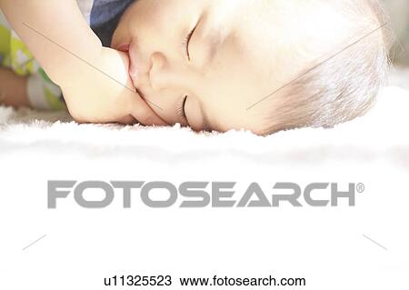 Stock Image - A sleeping baby. Fotosearch