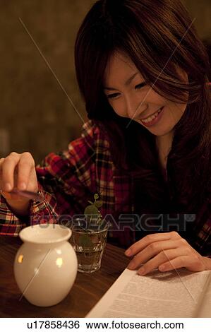 A woman enjoying aroma View Large Photo Image Stock Photograph - A woman enjoying aroma. Fotosearch