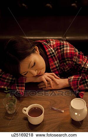 Stock Photo - A woman relaxing. Fotosearch