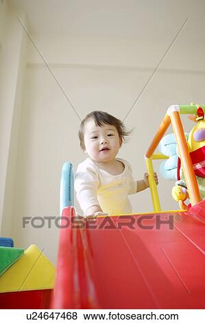 Stock Photo - Baby Girl by Slide. Fotosearch