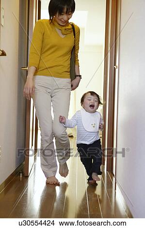 Picture - Baby Girl Running Beside Mother. Fotosearch