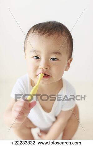 Boy Holding Toothbrush Brushing Teeth Hygiene View Large Photo Image Stock Image - Boy Holding Toothbrush Brushing Teeth Hygiene. Fotosearch