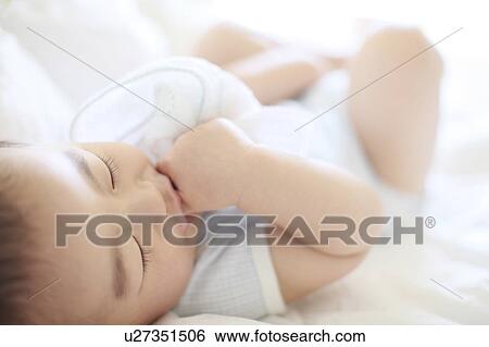 Boy Lying On Back Thumb Sucking Selective Focus View Large Photo Image Stock Photograph - Boy Lying On Back Thumb Sucking Selective Focus. Fotosearch