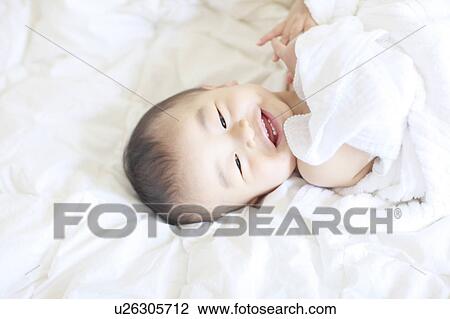 Boy Lying On Back Towel Smiling Mouth Open View Large Photo Image Stock Image - Boy Lying On Back Towel Smiling Mouth Open. Fotosearch