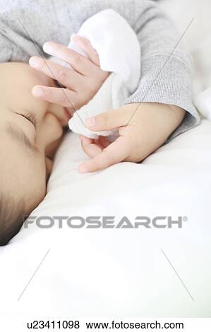 Boy Lying On Front Thumb Sucking Sleeping View Large Photo Image Stock Photo - Boy Lying On Front Thumb Sucking Sleeping. Fotosearch