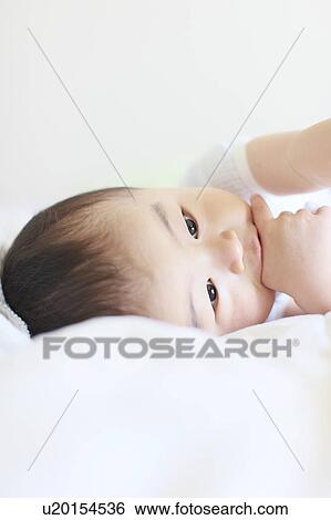 Boy Lying On Side Thumb Sucking View Large Photo Image Stock Photograph - Boy Lying On Side Thumb Sucking. Fotosearch