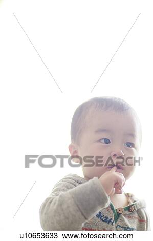 Boy Standing Finger In Mouth High Key Copy Space View Large Photo Image Stock Image - Boy Standing Finger In Mouth High Key Copy Space. Fotosearch