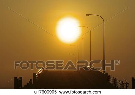 Stock Photography - Bridge Silhouette Sunset Sun Dramatic Sky. Fotosearch