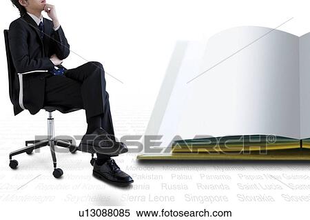 Stock Photography - Businessman Sitting Chair Hand On Chin Open Book. Fotosearch