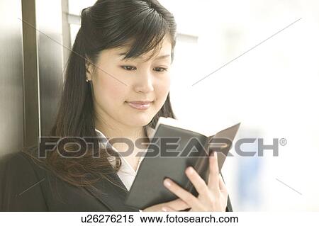 Stock Photography - Businesswoman Checking Her Diary. Fotosearch