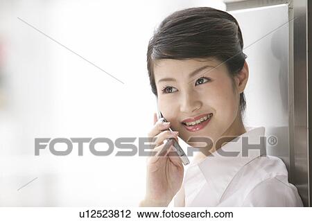 Stock Image - Businesswoman On Phone. Fotosearch