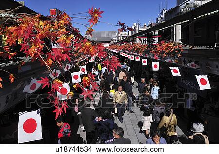 Busy Shopping Street Lined with Japanese Flags View Large Photo Image Picture - Busy Shopping Street Lined with Japanese Flags. Fotosearch