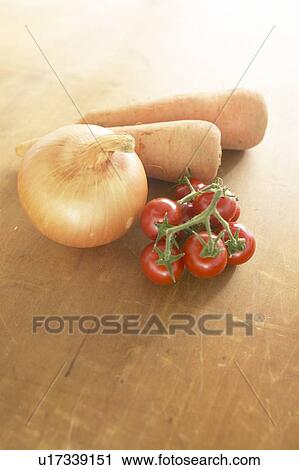 Stock Image - Carrots, Tomatoes and Onion. Fotosearch