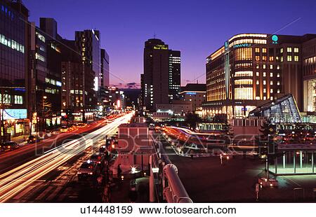 Stock Photo - Cityscape Department Architecture Illuminated Road. Fotosearch