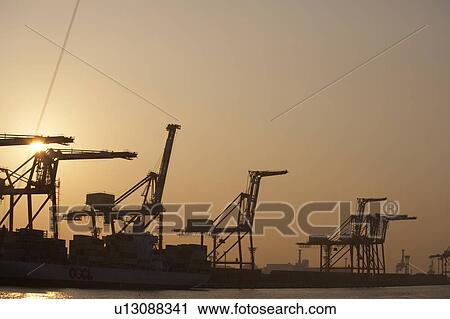 Stock Image - Commercial Dock Crane Architecture Sky Copy Space. Fotosearch