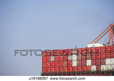 Stock Photo - Commercial Dock Crane Architecture Sky Copy Space. Fotosearch