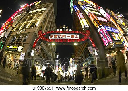 Stock Image - Crowd in Street at Night. Fotosearch