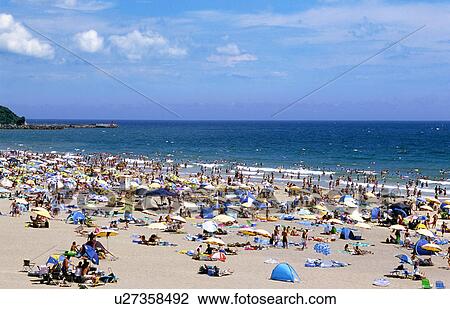 Stock Image - Crowd Onjuku Beach Sea Horizon Over Water Summer. Fotosearch