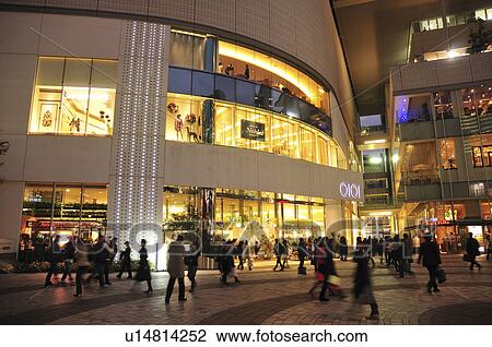 Stock Image - Crowded Town Square at Night. Fotosearch
