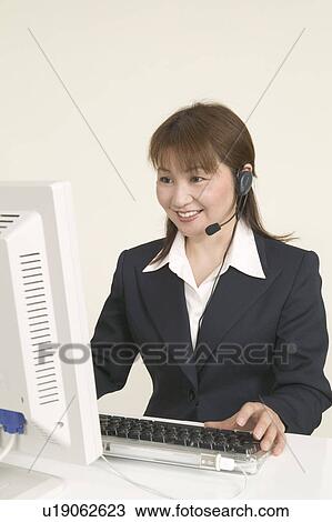 Stock Image - Customer Service Representative Working. Fotosearch