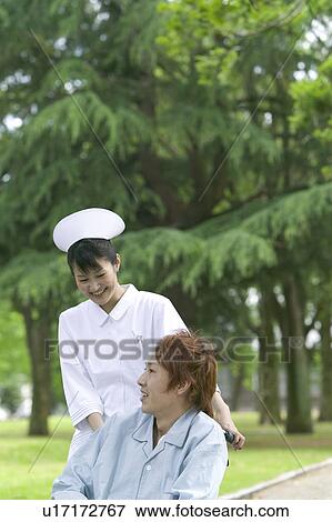 Female Nurse and Male Patient View Large Photo Image Stock Photo - Female Nurse and Male Patient. Fotosearch