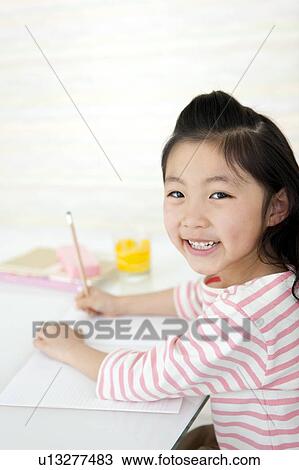 Girl doing homework View Large Photo Image Stock Image - Girl doing homework. Fotosearch