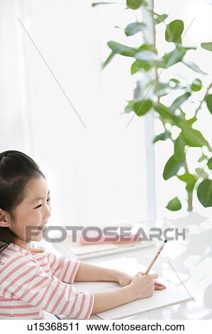 Girl doing homework View Large Photo Image Stock Image - Girl doing homework. Fotosearch