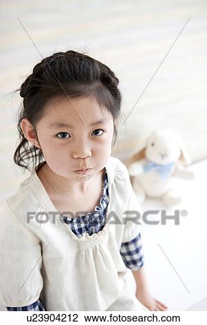 Stock Image - Girl making a face. Fotosearch