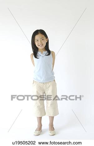 Girl Standing Portrait Looking At Camera Smiling View Large Photo Image Stock Image - Girl Standing Portrait Looking At Camera Smiling. Fotosearch