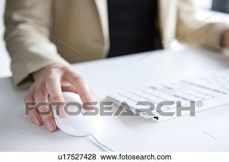 Hand of woman using a computer mouse View Large Photo Image Stock Photo - Hand of woman using a computer mouse. Fotosearch