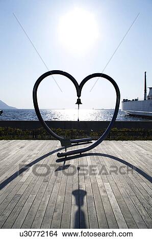 Heart Shape Sculpture Bell Boardwalk Sea View Large Photo Image Picture - Heart Shape Sculpture Bell Boardwalk Sea. Fotosearch