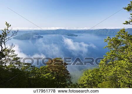 Stock Photo - Lake Towada Water Fog Tree Forest High Angle View. Fotosearch