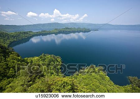 Stock Photograph - Lake Towada Water Reflection Forest Cloud Sky. Fotosearch