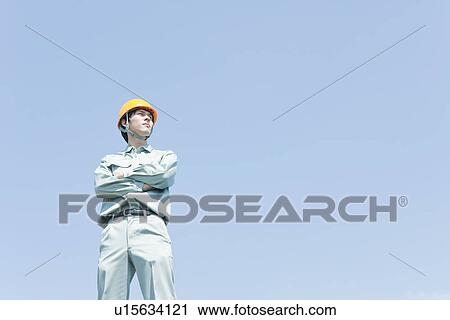 Male Worker in Uniform and Hardhat View Large Photo Image Stock Image - Male Worker in Uniform and Hardhat. Fotosearch