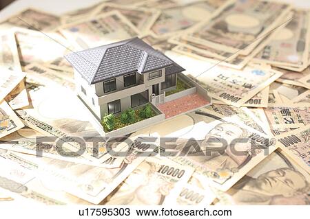 Stock Image - Model House and Notes. Fotosearch