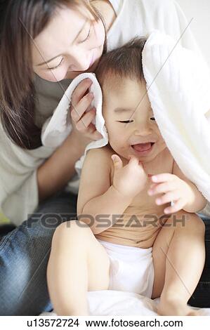 Picture - Mother Son Sitting Drying Towel Smiling. Fotosearch