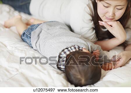 Mother Son Sleeping Lying Down Holding Finger View Large Photo Image Stock Photo - Mother Son Sleeping Lying Down Holding Finger. Fotosearch