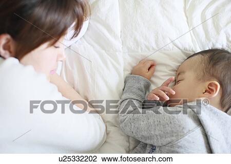 Mother Son Sleeping Next To Lying Down View Large Photo Image Stock Image - Mother Son Sleeping Next To Lying Down. Fotosearch